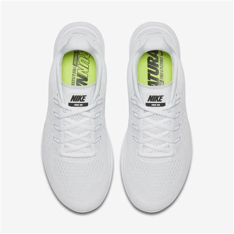 white nike running shoes.